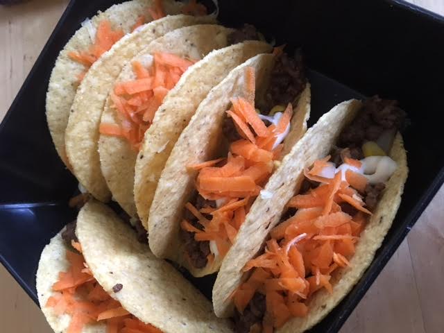 Tacos - cheese on the bottom, then minced beef, then carrots!