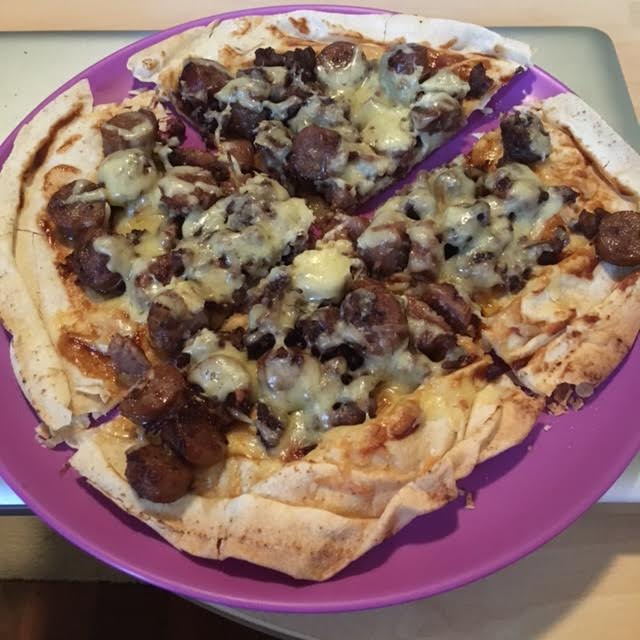 Home made meat lovers pizza on Lebanese bread